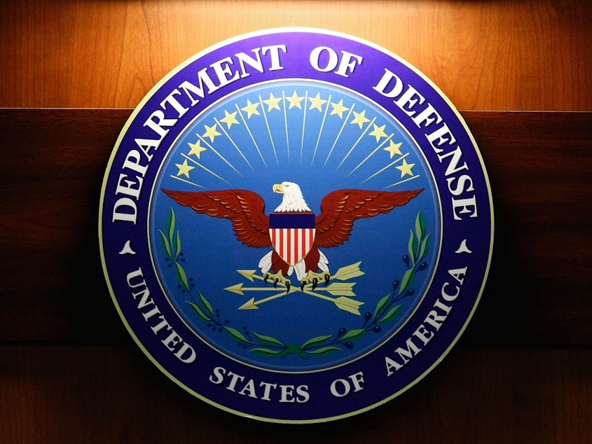 caption: The seal of the Department of Defense.