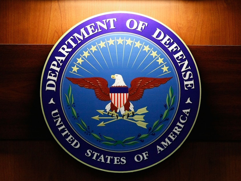caption: The seal of the Department of Defense.