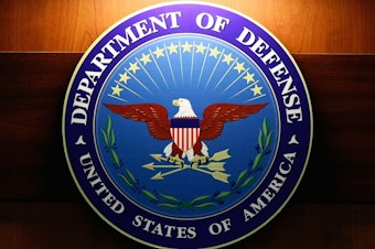 caption: The seal of the Department of Defense.