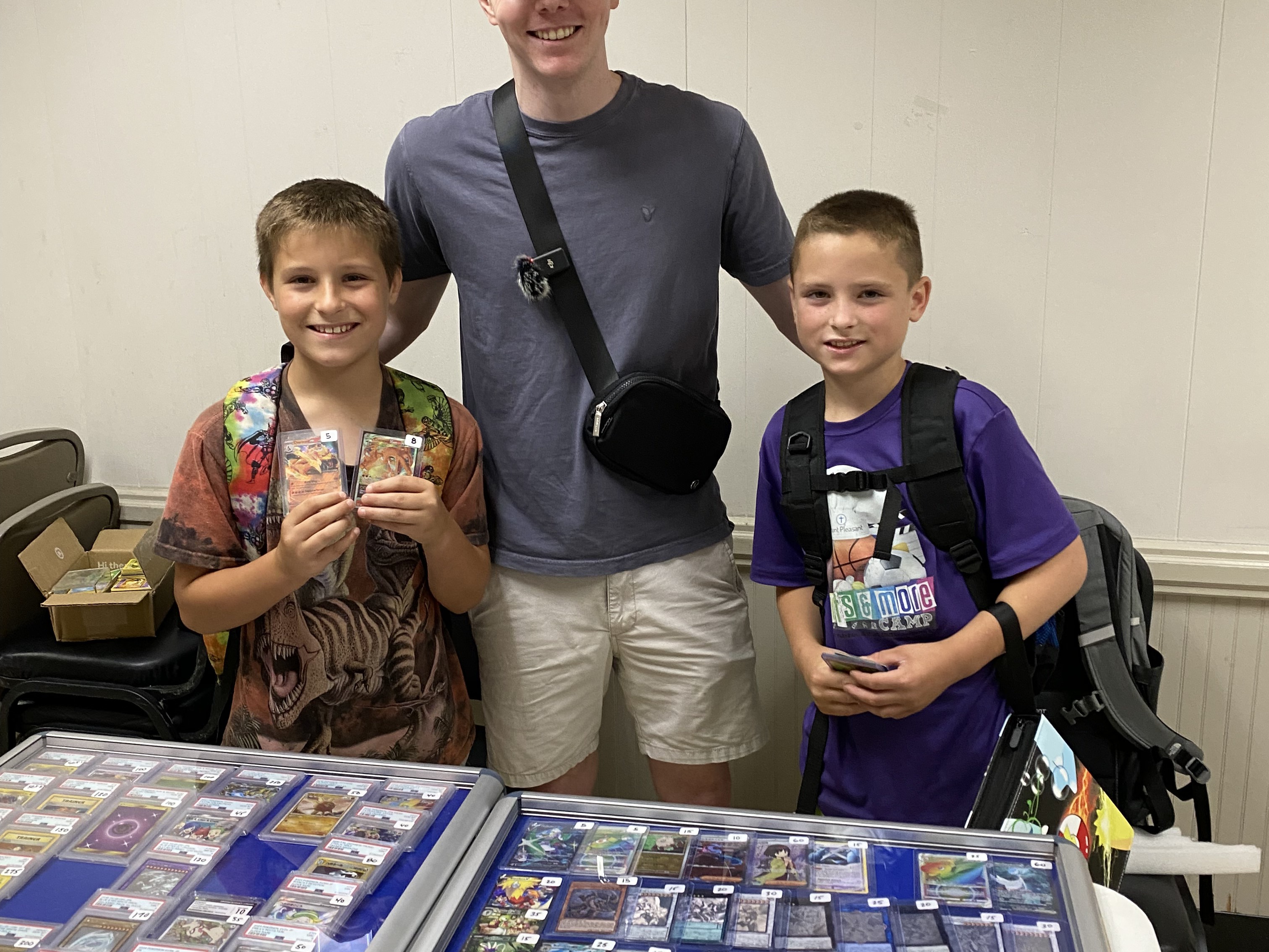 caption:  Ross "Coop" Cooper and traders at a recent Pokémon card convention.