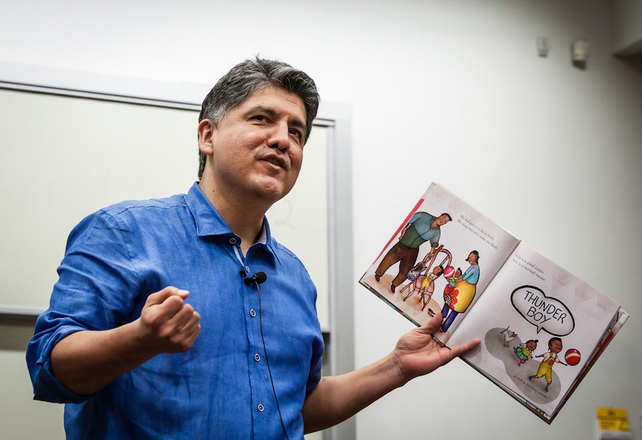 caption: File: Sherman Alexie reads from his book, 'Thunder Boy Jr.,' at the RED INK Indigenous Initiative for All at Arizona State University, Tempe, April 22, 2016.