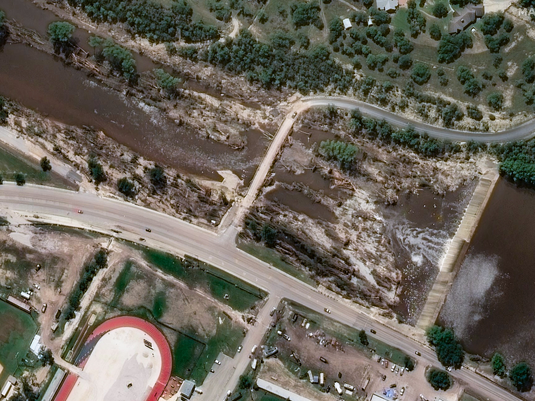 caption: Imgram dam after flash flood in Texas