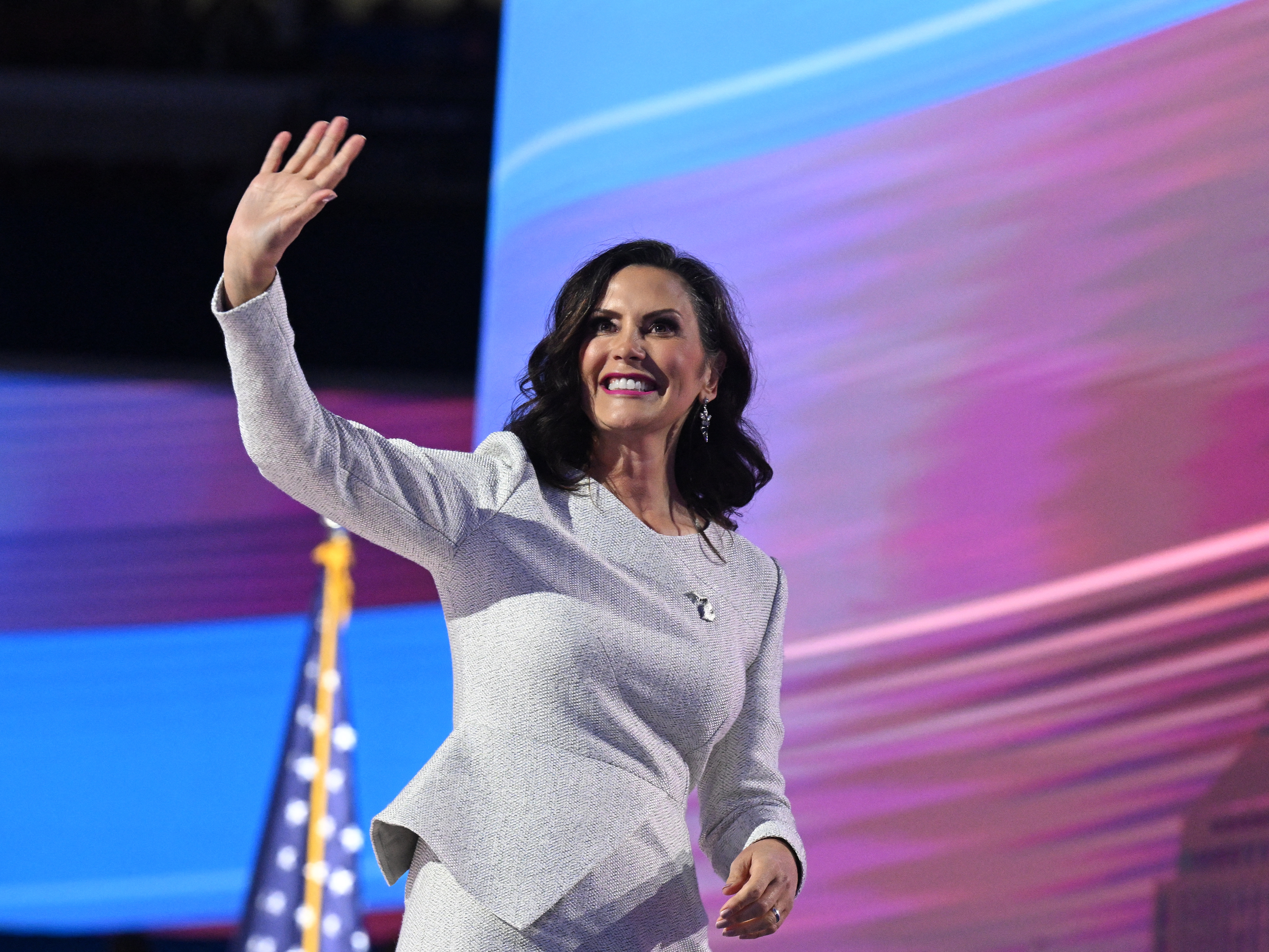 caption: Michigan Gov. Gretchen Whitmer walks off stage after speaking on the fourth and last day of the Democratic National Convention (DNC) at the United Center in Chicago.