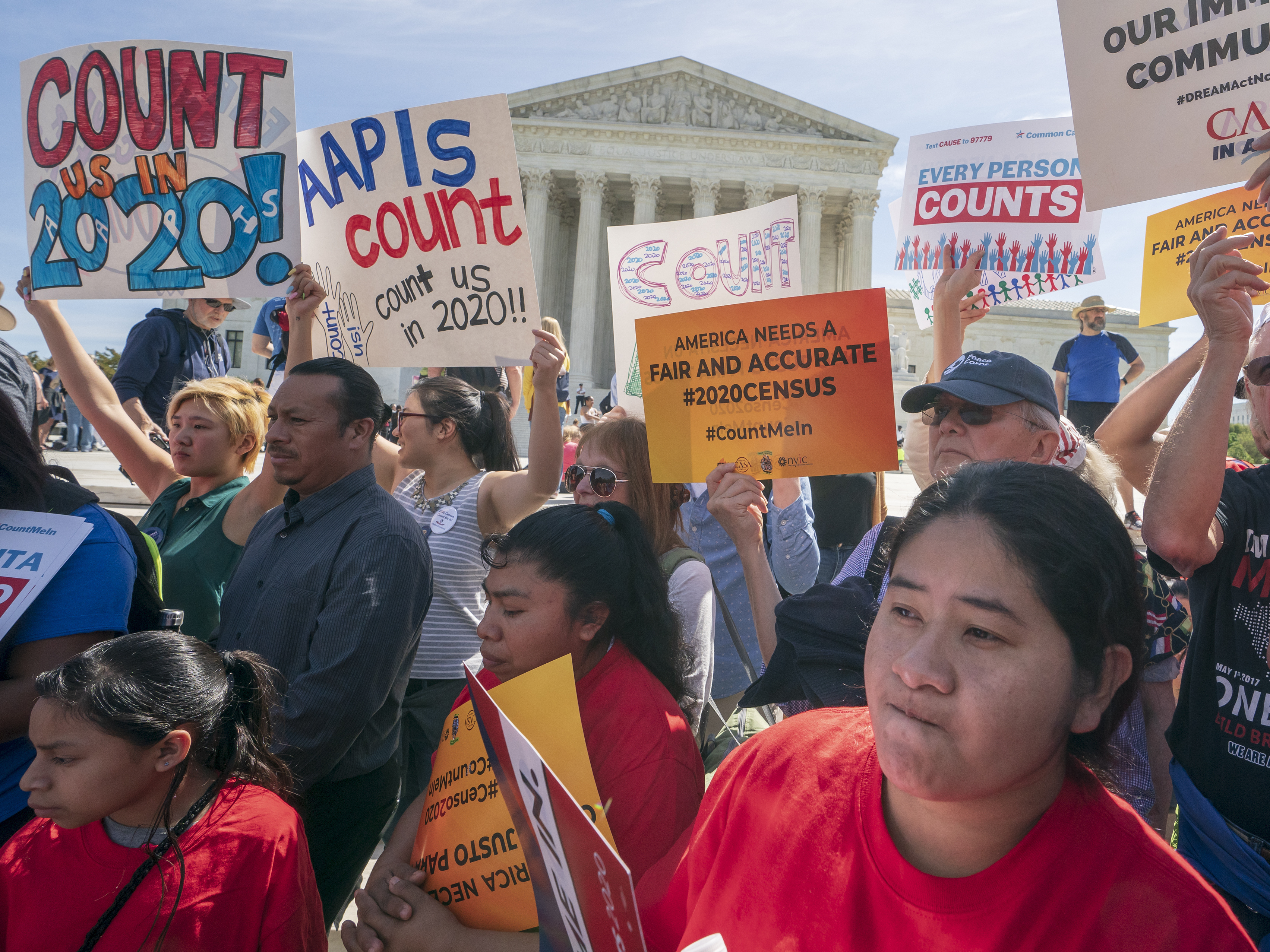 caption: Demonstrators against the Trump administration's push to add a citizenship question to the 2020 census rally outside the U.S. Supreme Court in Washington, D.C., in April.