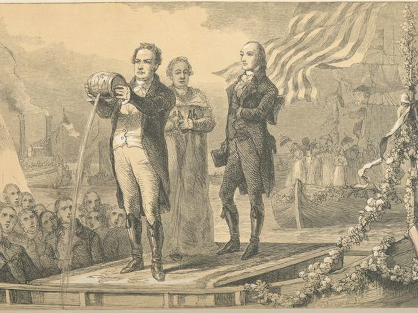 caption: DeWitt Clinton pours water from Lake Erie into the Atlantic Ocean after completion of the Erie Canal.