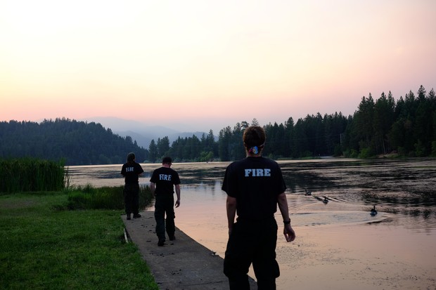 caption: <p>Fire crews come from all over the country to fight big fires. Everyone at the camp works 18 hour days for two weeks, and then gets two days of rest. There can be hundreds of firefighters sleeping in tents at any fire camp. That means a lot of port-a-potties, hand washing stations, and portable showers.</p>