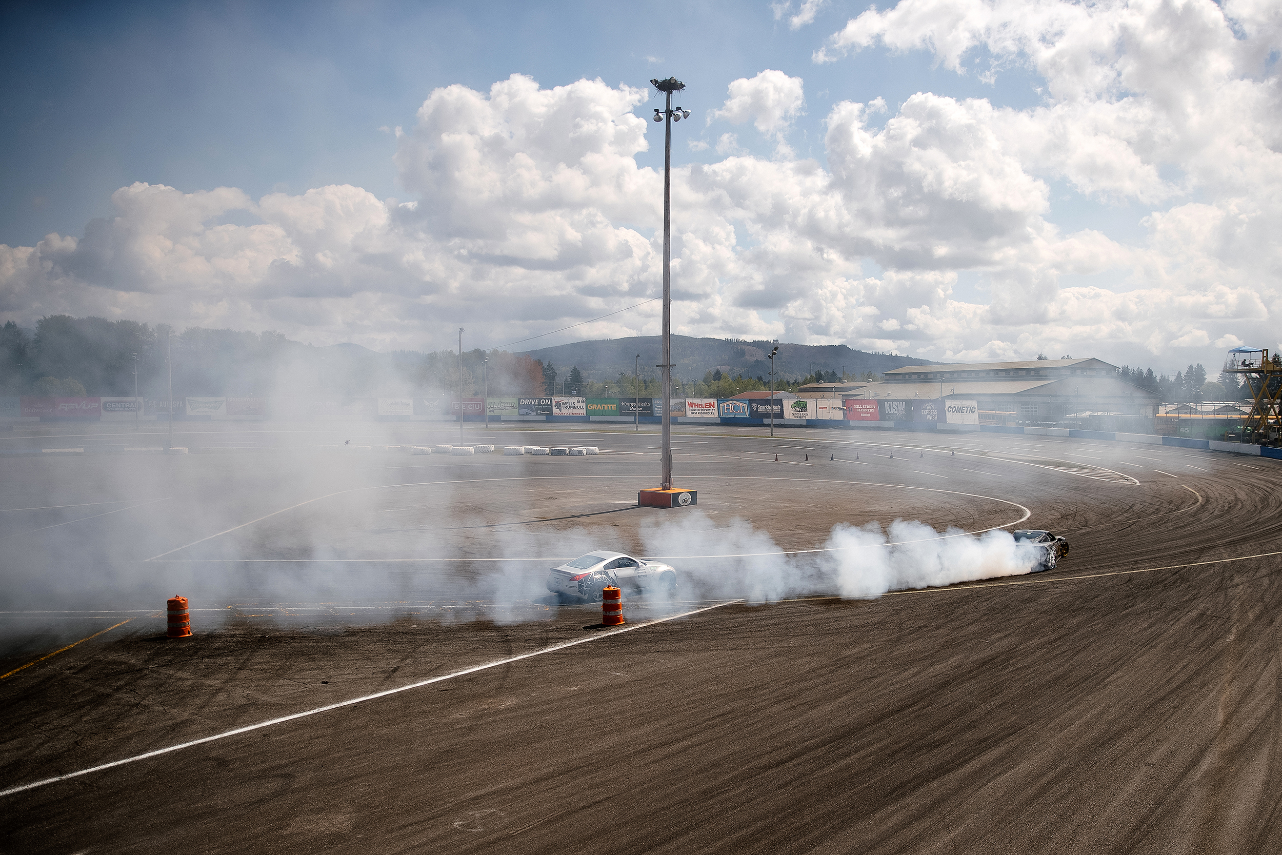 caption: Drivers compete in DriftCon on Saturday, April 19, 2025, at Evergreen Speedway in Monroe. DriftCon draws hundreds of people out for drifting battles and a car show. It’s one of many events central to the Seattle area's tuner car scene, defined by enthusiasm for customizing otherwise ordinary vehicles with aesthetic and functional enhancements.