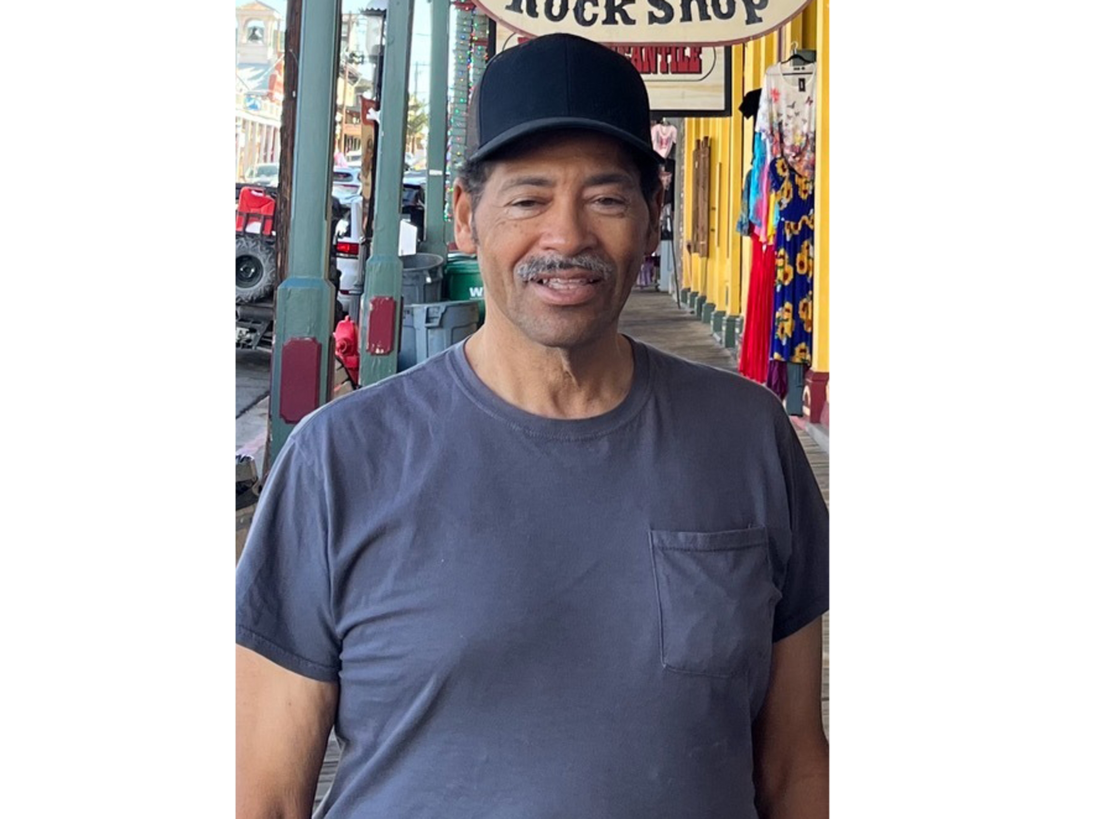 caption: Victor Shaw loved sports, especially football and basketball. He and his sister regularly watched games together.