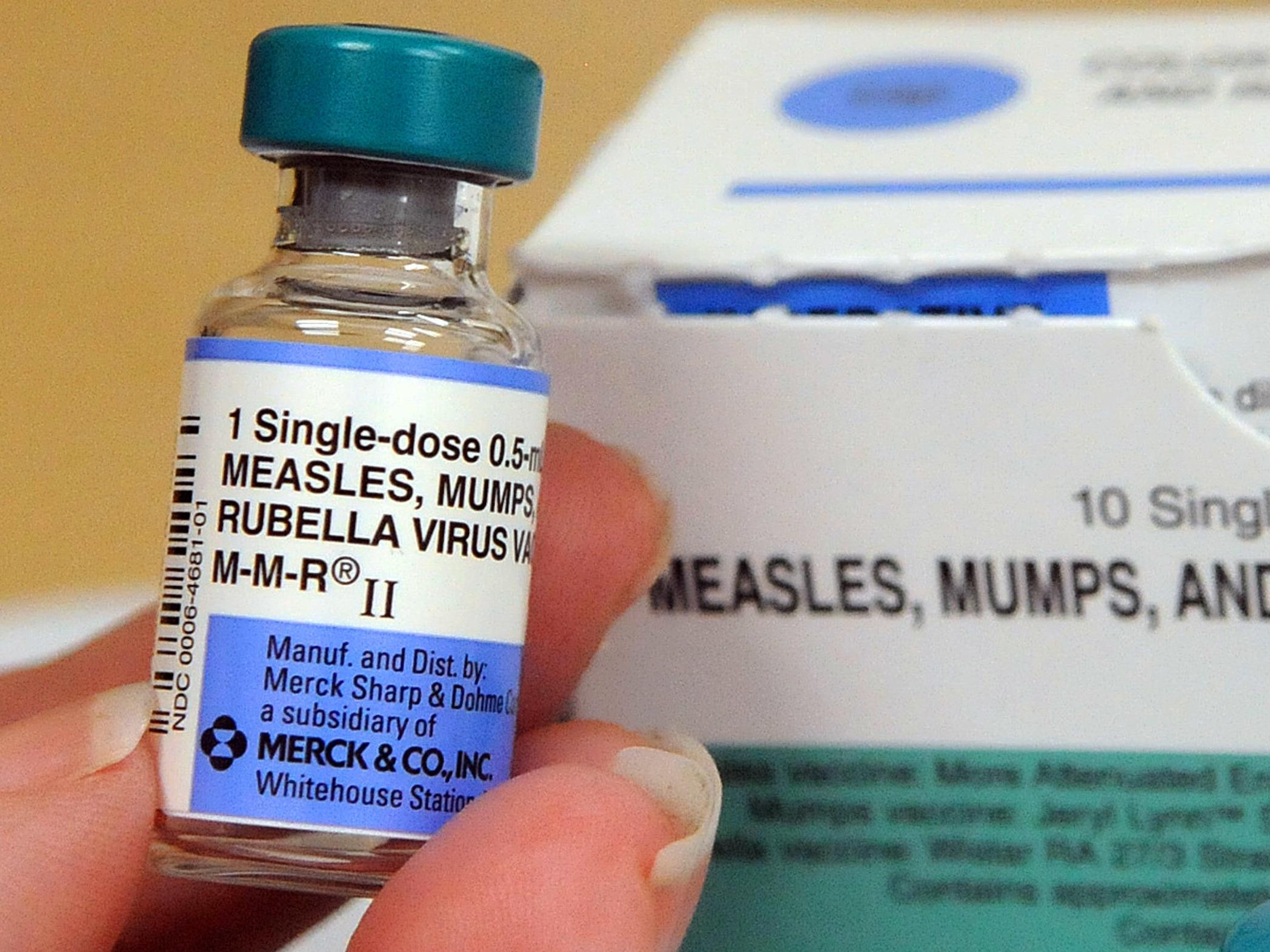 caption: A nurse displays vials of measles vaccine at the Orange County Health Department in May. Health officials said Thursday that new U.S. measles cases for 2019 so far have broken a 25-year-old record.