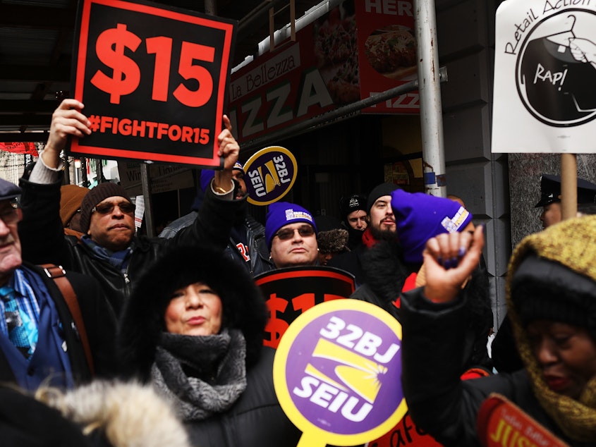 Protesters with NYC Fight for $15 gather in front of a McDonalds.