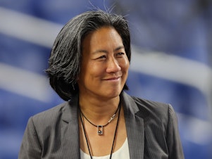caption: The Miami Marlins' Kim Ng is the first female general manager in MLB history to lead her team to the playoffs.