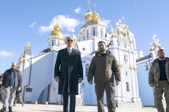 caption: President Joe Biden walks with Ukrainian President Volodymyr Zelenskyy at St. Michael's Golden-Domed Cathedral on a surprise visit on Feb. 20.