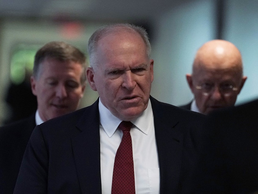 caption: Former CIA Director John Brennan arrives at a May 2018 Senate hearing. President Trump revoked Brennan's security clearance Wednesday, claiming Brennan was acting "erratic."
