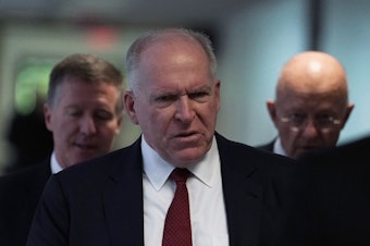 caption: Former CIA Director John Brennan arrives at a May 2018 Senate hearing. President Trump revoked Brennan's security clearance Wednesday, claiming Brennan was acting "erratic."
