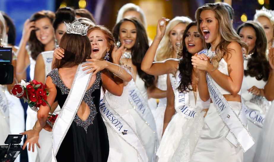 caption: Miss North Dakota Cara Mund is congratulated by contestants after being named Miss America during Miss America 2018 pageant, Sunday, Sept. 10, 2017, in Atlantic City, N.J. Miss Washington Nicole Renard is shown at right. 