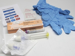 caption: A drug overdose rescue kit is pictured in Buffalo, N.Y. The Biden administration plans to increase access to clean needles, fentanyl test strips and naloxone to combat drug overdose deaths.
