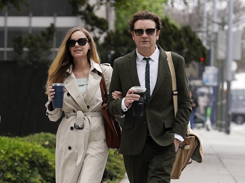 caption: Danny Masterson and his wife Bijou Phillips arrive for closing arguments in his second rape trial on May 16, 2023, in Los Angeles.