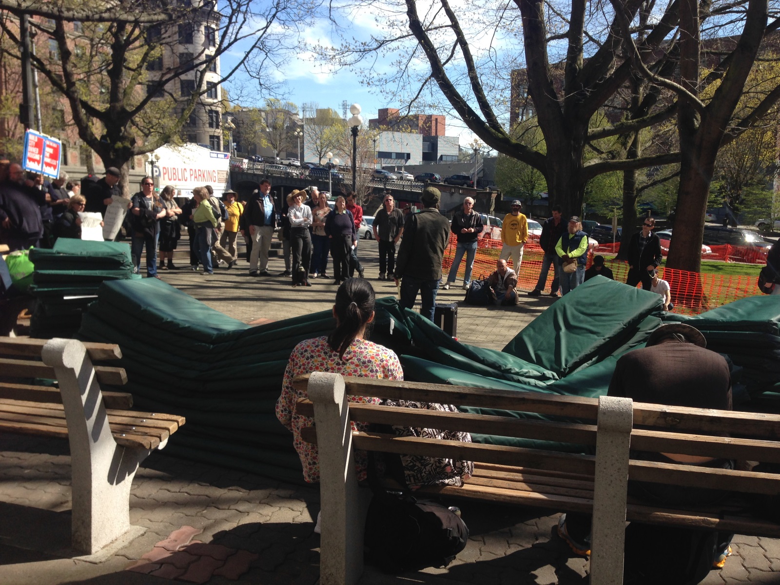 caption: About 100 mattresses in the foreground as friends of SHARE prepare to camp outside the King County Administration Building.
