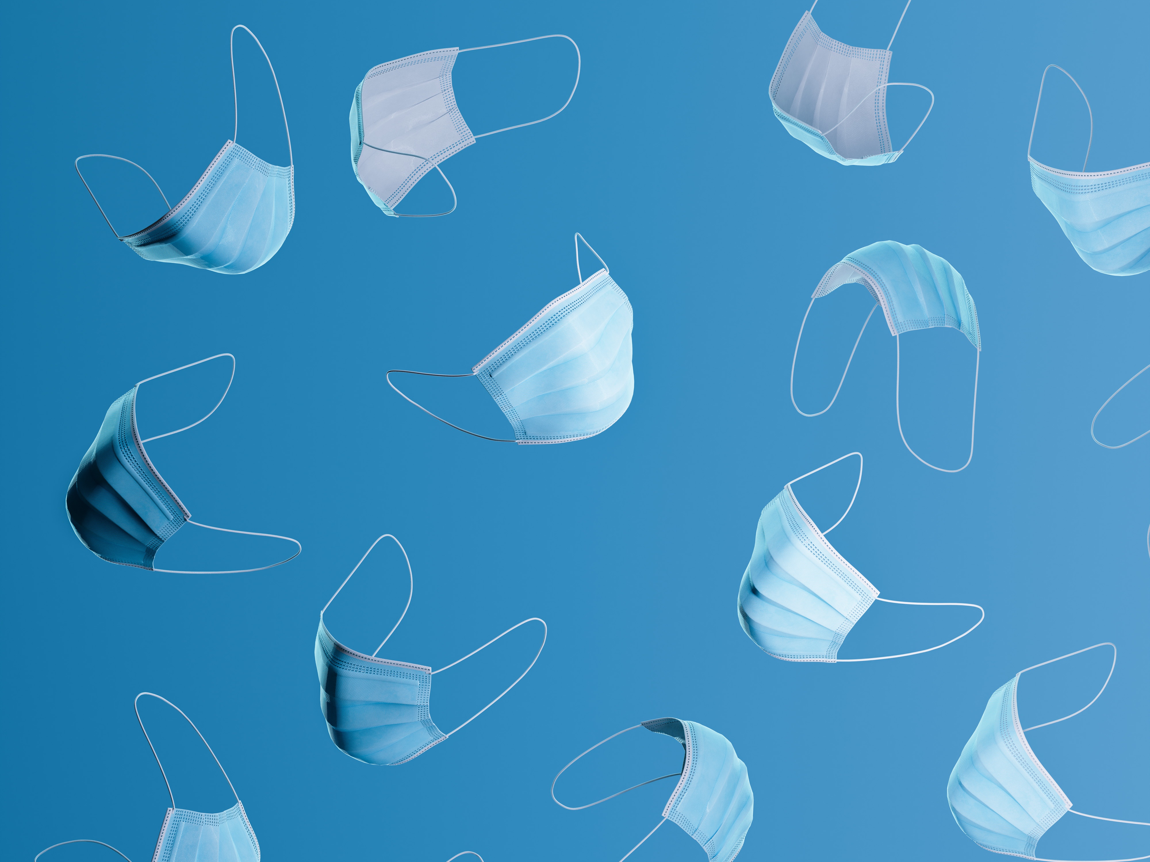 caption: Face masks can dampen the spread of contagious diseases.