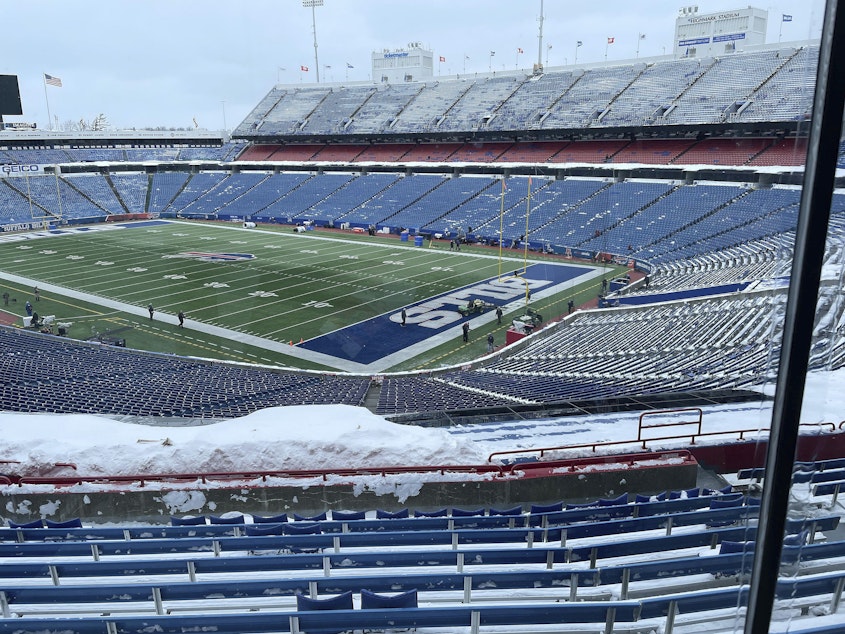 caption: A few flurries fall at the stadium mostly-cleared of snow in Orchard Park, N.Y, ahead of the NFL football game between the Buffalo Bills and Kansas City Chiefs on Sunday.