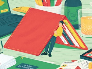 Illustration of a person in miniature hiding underneath a tented wallet on a desk, peering out to a tablescape of bills, finance apps, a laptop, receipts and a few drinks, symbolizing hiding from money problems.