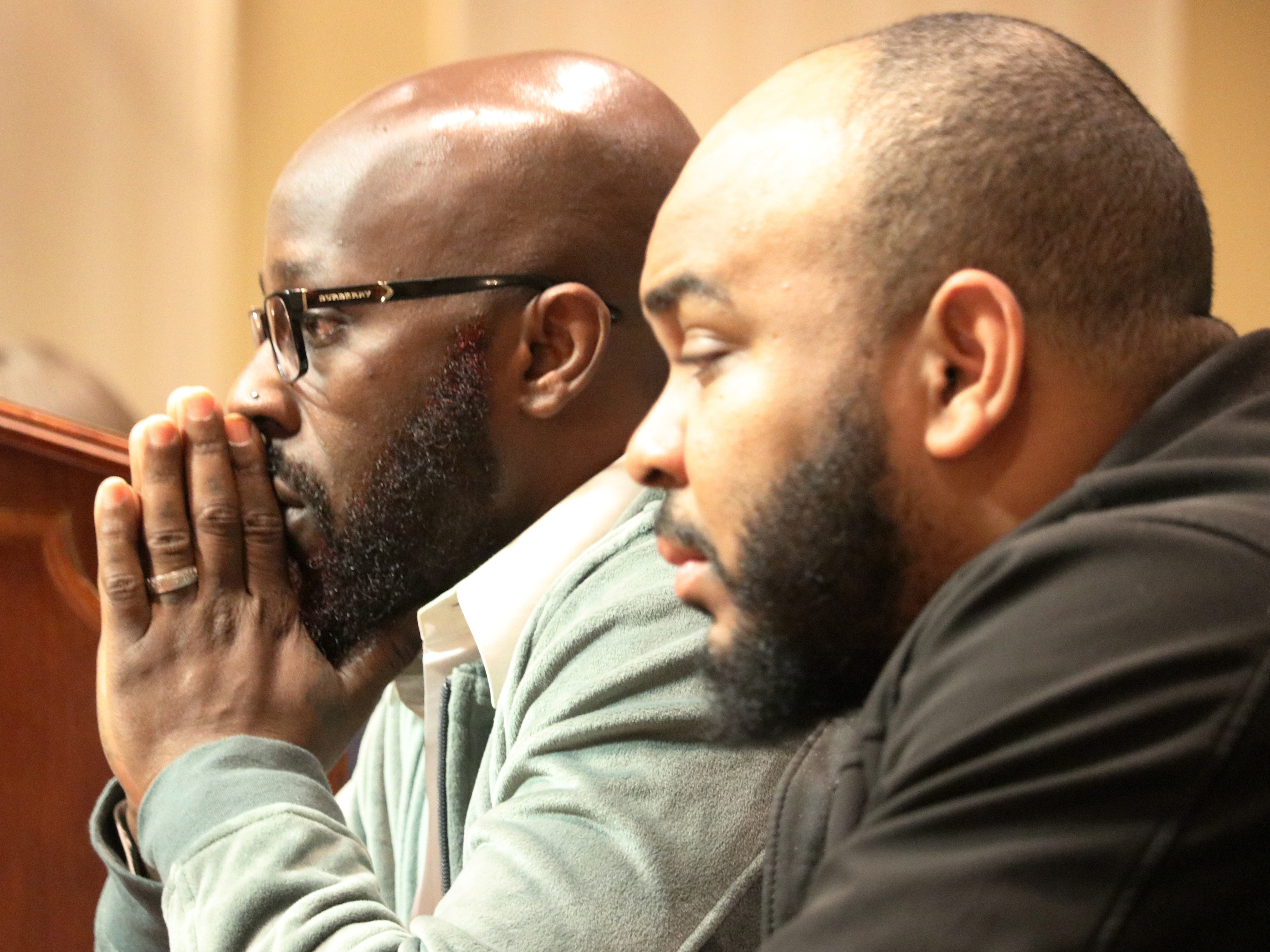 caption: Eric Simmons (left) and Demetrius Smith, who were found innocent after spending years in prison for crimes they did not commit in Maryland, testify before state lawmakers for legislation to address how the wrongly incarcerated should be compensated by the state during a hearing on Feb. 26, 2020, in Annapolis, Md.