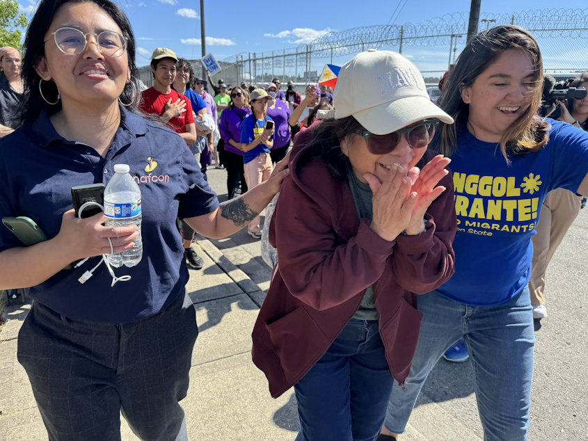 caption: University of Washington employee and Filipina green card holder Lewelyn Dixon (center) was released from the Tacoma ICE center on Thursday, May 29, 2025 after being in detention for several months.