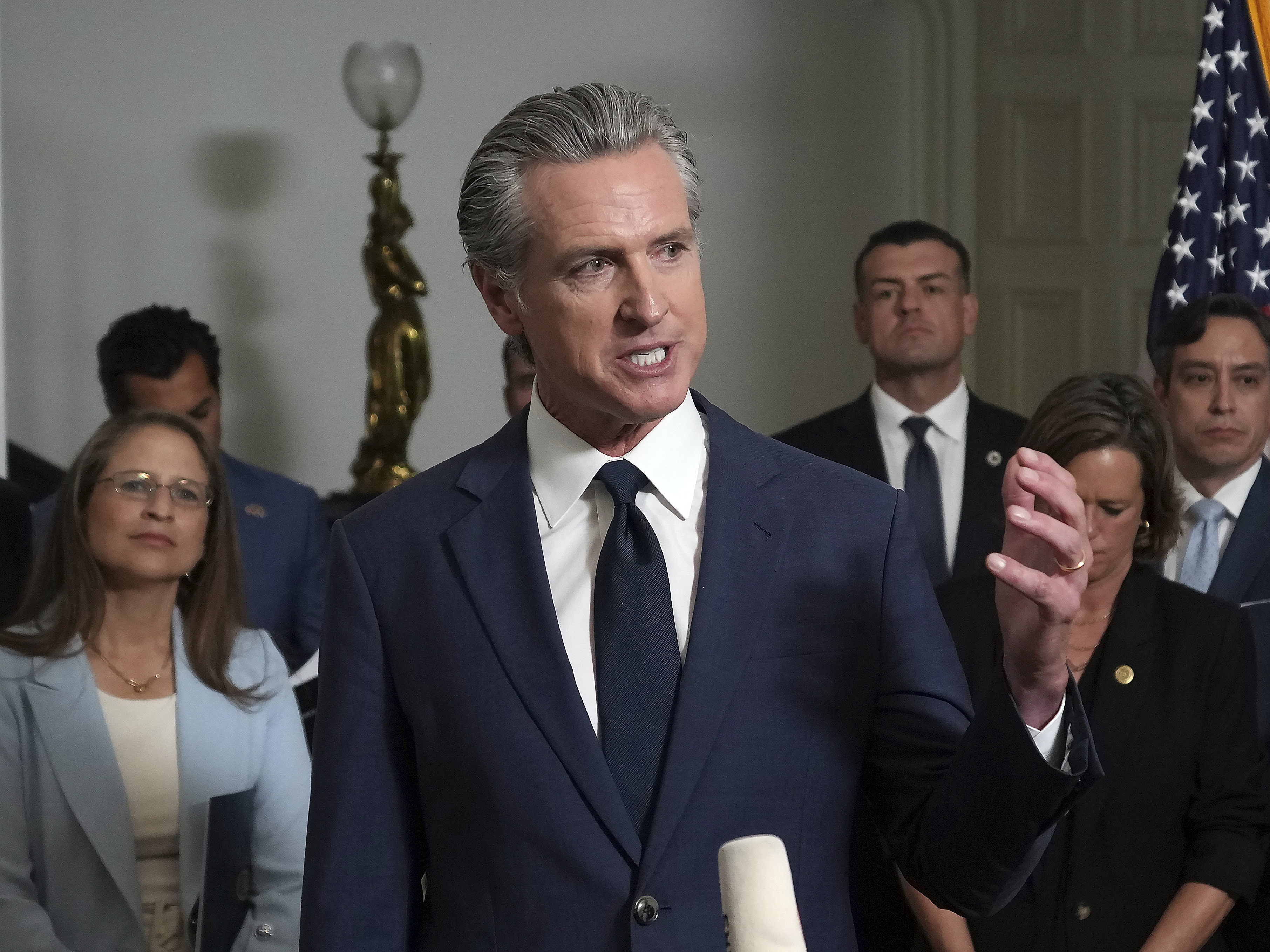 caption: Accompanied by California and Texas lawmakers, California Gov. Gavin Newsom speaks in support of the Texas Democratic lawmakers for their walkout to block a vote on a congressional redistricting plan sought by President Donald Trump, during a news conference in Sacramento, Calif., Friday Aug. 8, 2025.