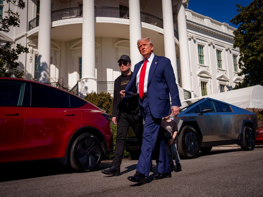 caption: President Trump and White House senior adviser, Tesla and SpaceX CEO Elon Musk depart after looking at Tesla vehicles on the South Lawn of the White House on Tuesday.