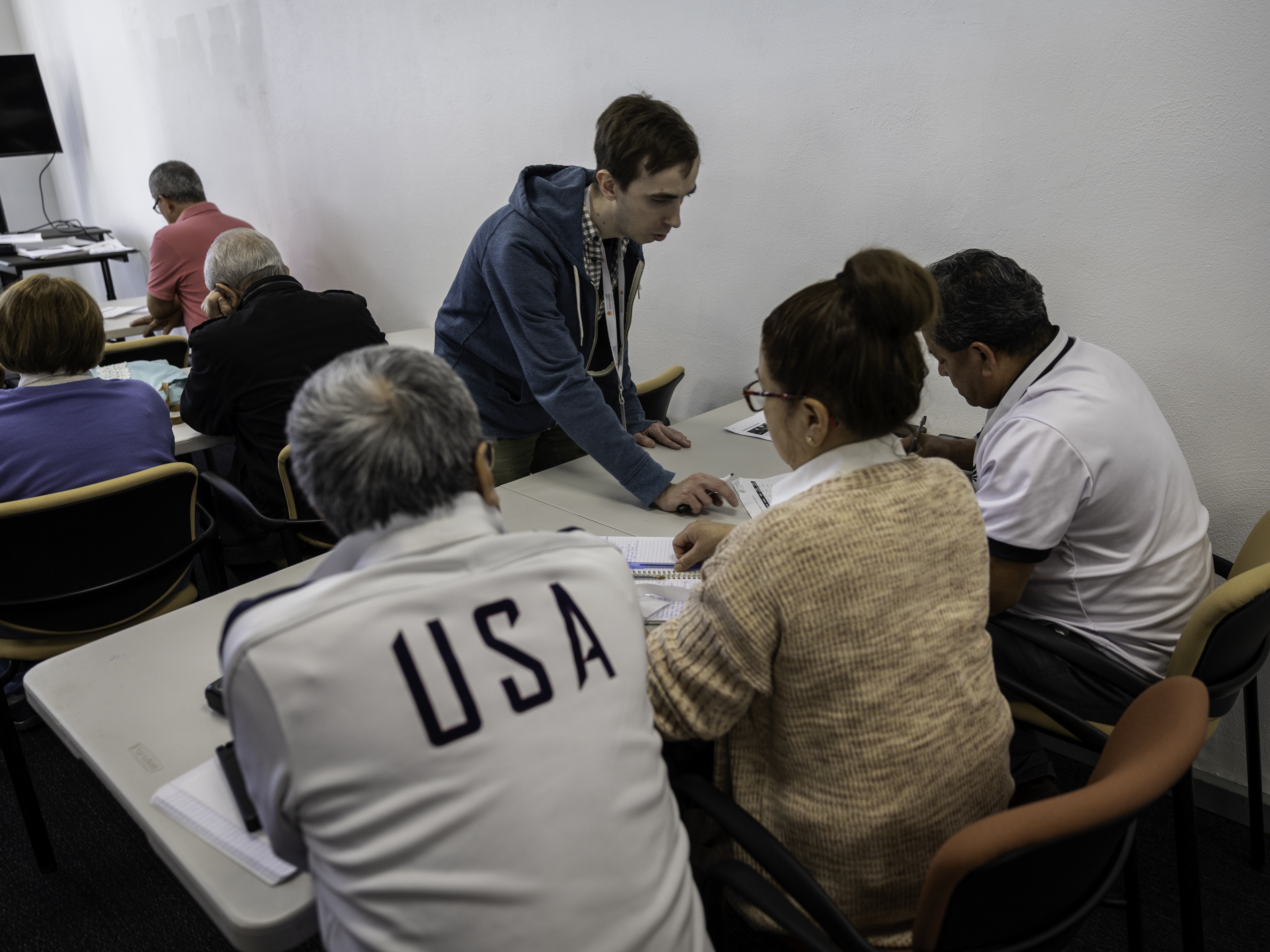 caption: Immigrants study for a U.S. citizenship exam in Connecticut. The Census Bureau says net immigration dropped sharply in the 12 months ending last June.