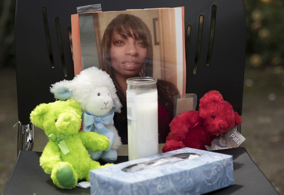 caption: A photograph of Charleena Lyles is shown at a memorial outside of Solid Ground Brettler Family Place on Monday, June 18, 2017, in Seattle, Washington. Lyles was shot and killed by Seattle police officers. 