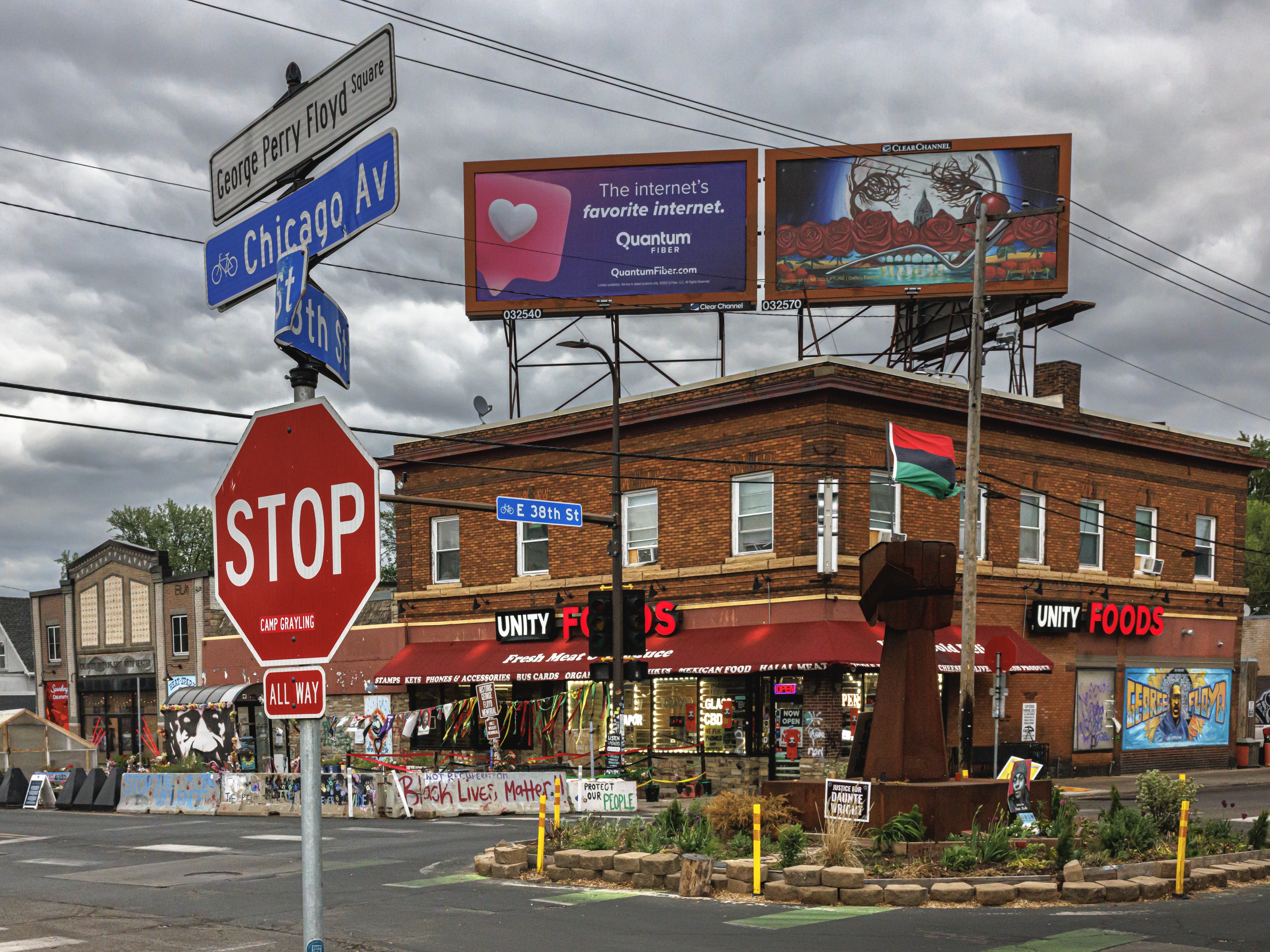 caption: The intersection where a Minneapolis police officer murdered George Floyd has an uncertain future. The memorial site has become a meeting place for activists, but some businesses say the corner is trapped in time.
