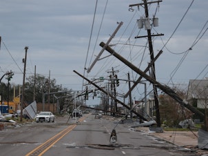 caption: A street is seen strewn with debris and downed power lines after Hurricane Laura passed through Lake Charles, Louisiana, on Thursday.