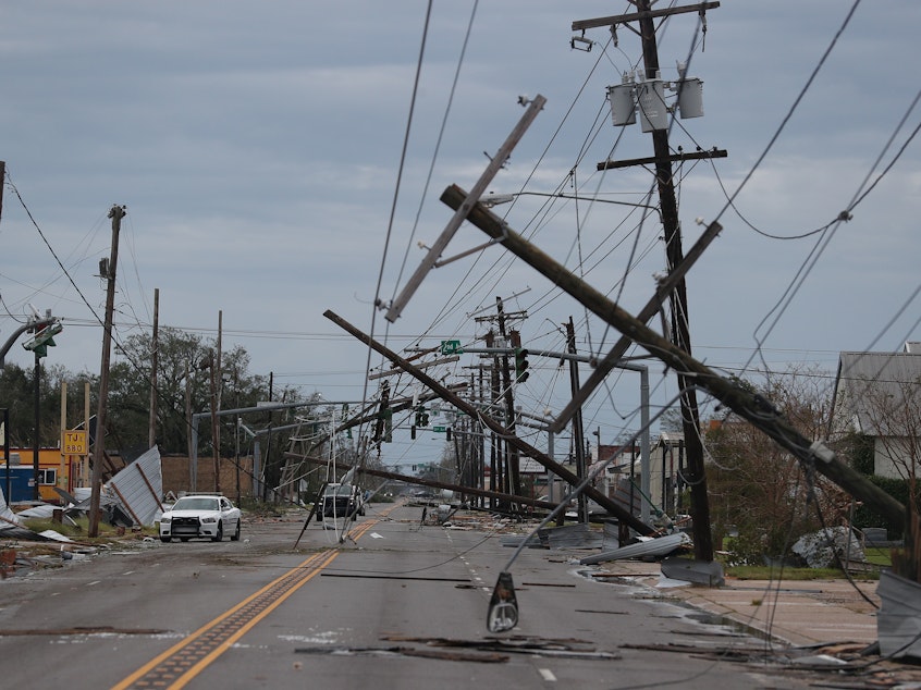 caption: A street is seen strewn with debris and downed power lines after Hurricane Laura passed through Lake Charles, Louisiana, on Thursday.