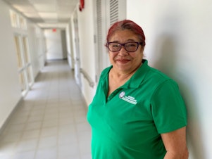 caption: Carmen Chevere says living through Hurricane Maria has left her anxious and fearful.