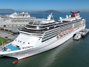 caption: A Carnival cruise ship docked in San Francisco, California.