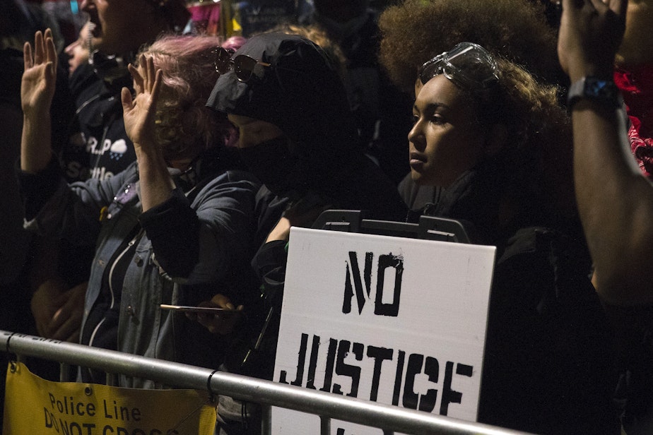 caption: Thousands of people protesting police brutality and the unjust deaths of Black Americans at the hands of law enforcement gathered on the fifth day of protests following the violent police killing of George Floyd on Tuesday, June 2, 2020, at the intersection of 11th and Pine Streets in  Seattle. 