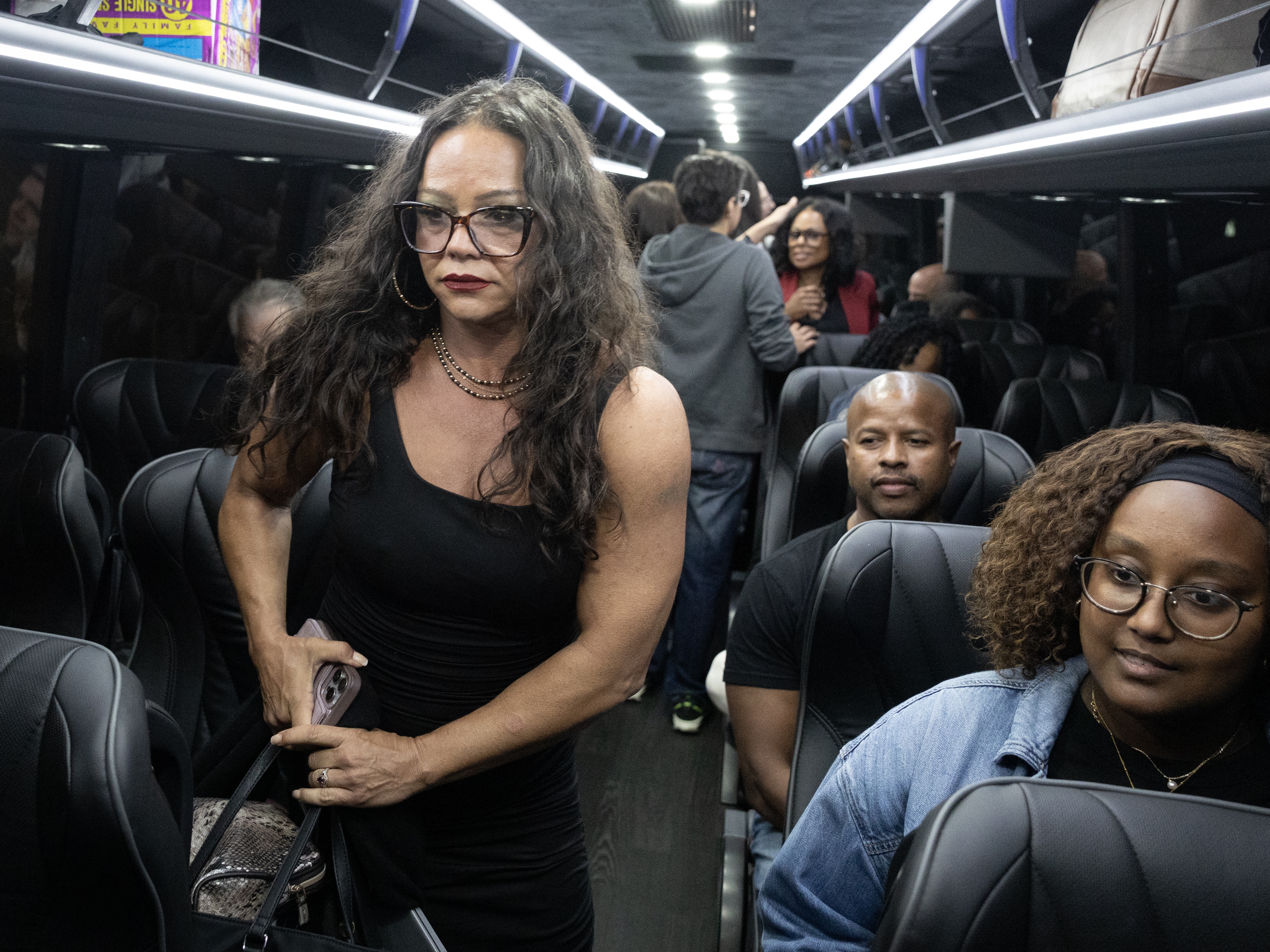 caption: Texas state lawmakers board a bus following a press conference at the DuPage County Democratic Party headquarters on August 03, 2025 in Carol Stream, Ill. The group of Democratic lawmakers left the state earlier today so a quorum could not be reached during a special session called to redistrict the state.
