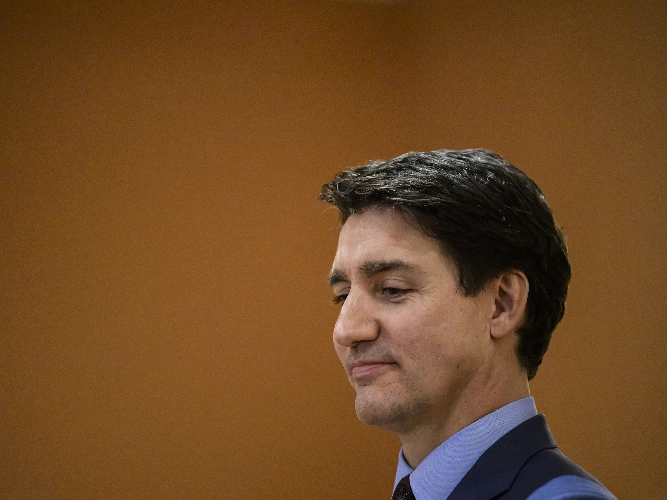 caption: Canada's Prime Minister Justin Trudeau looks on at the start of a cabinet swearing in ceremony for Dominic LeBlanc, not shown, who will be sworn in as Finance Minister, at Rideau Hall in Ottawa, Ontario, on Dec. 16, 2024.
