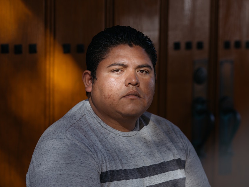 caption: Alexander Antonio Burgos Mejia was detained at the Adelanto ICE Processing Center in 2017, when he went on a hunger strike to protest conditions at the facility. He said he and the other detainees suffered burns and other injuries, after GEO Group staff used pepper spray. "I will never forget seeing the faces of my friends, seeing them crying," he said.