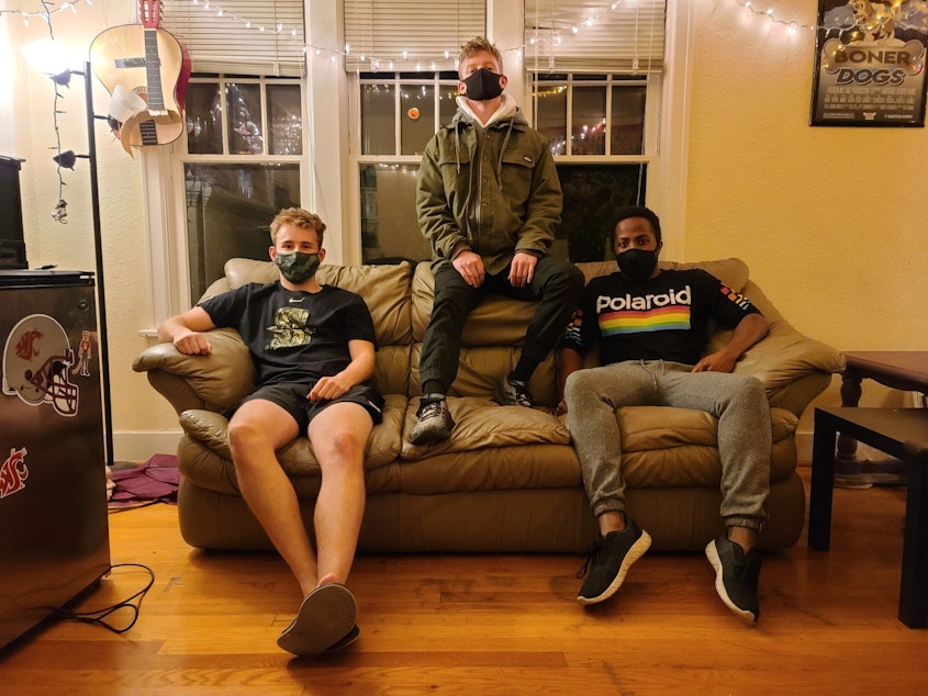 caption: WSU roommates Dan, Campbell, Zack. When Dan got the virus, they all wore masks to keep each other safe.