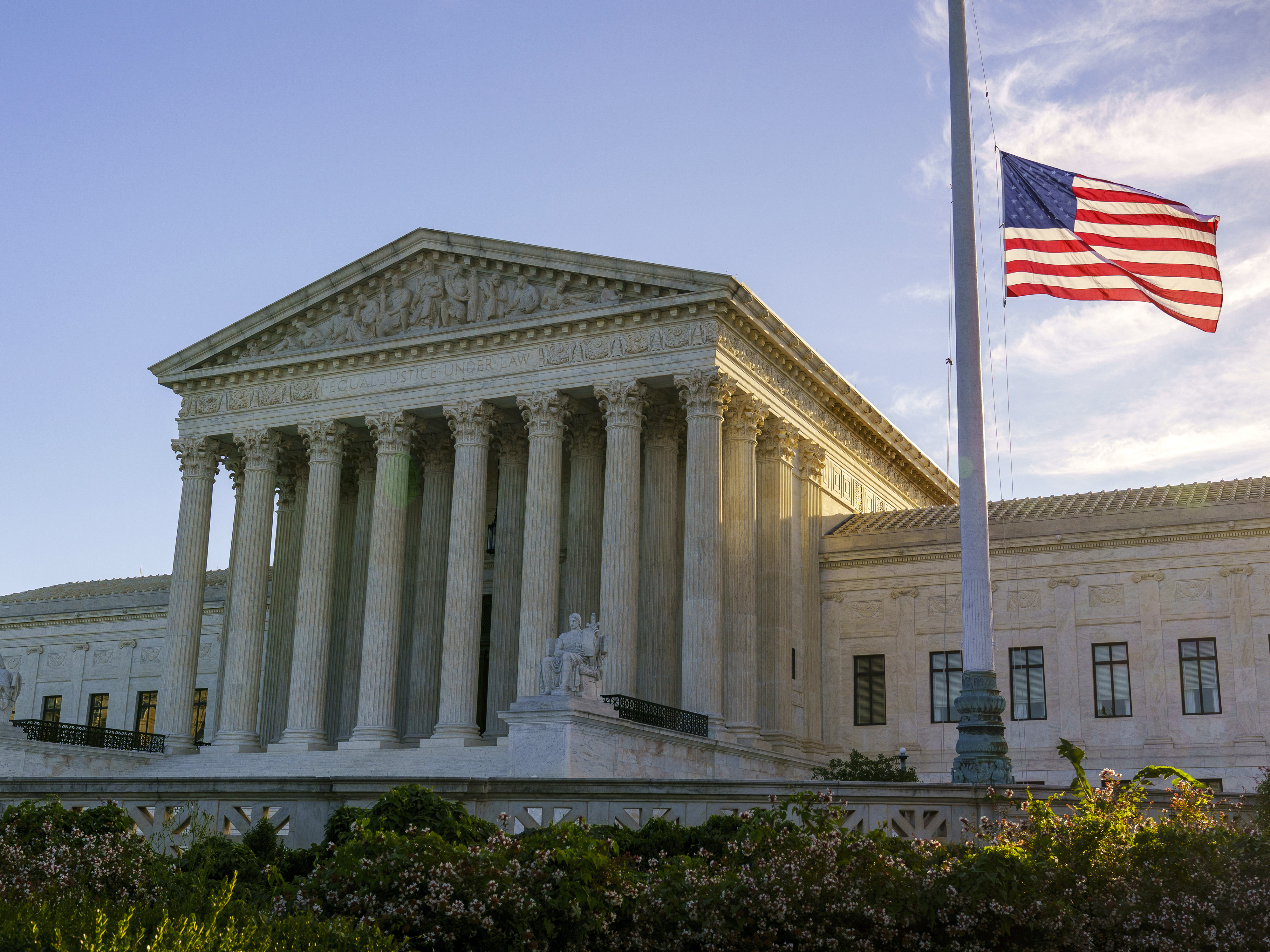 caption: The flag flies at half-staff Saturday at the Supreme Court on the morning after the death of Justice Ruth Bader Ginsburg.