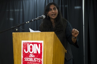 caption: Councilmember Kshama Sawant addresses supporters after early election results showed her trailing behind her District 3 opponent Egan Orion on Tuesday, November 5, 2019, during an election night party at Langston Hughes Performing Arts Institute in Seattle. 