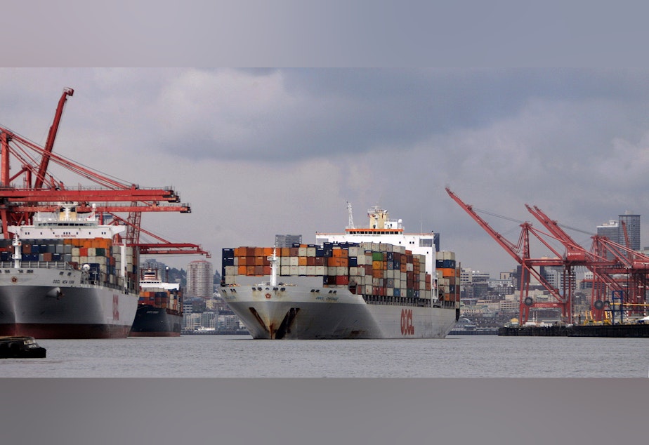 caption: A fully loaded container ship heads up the Duwamish Waterway and into the Port of Seattle past other ships already in position to be unloaded in this Wednesday, June 8, 2005, file photo in Seattle.