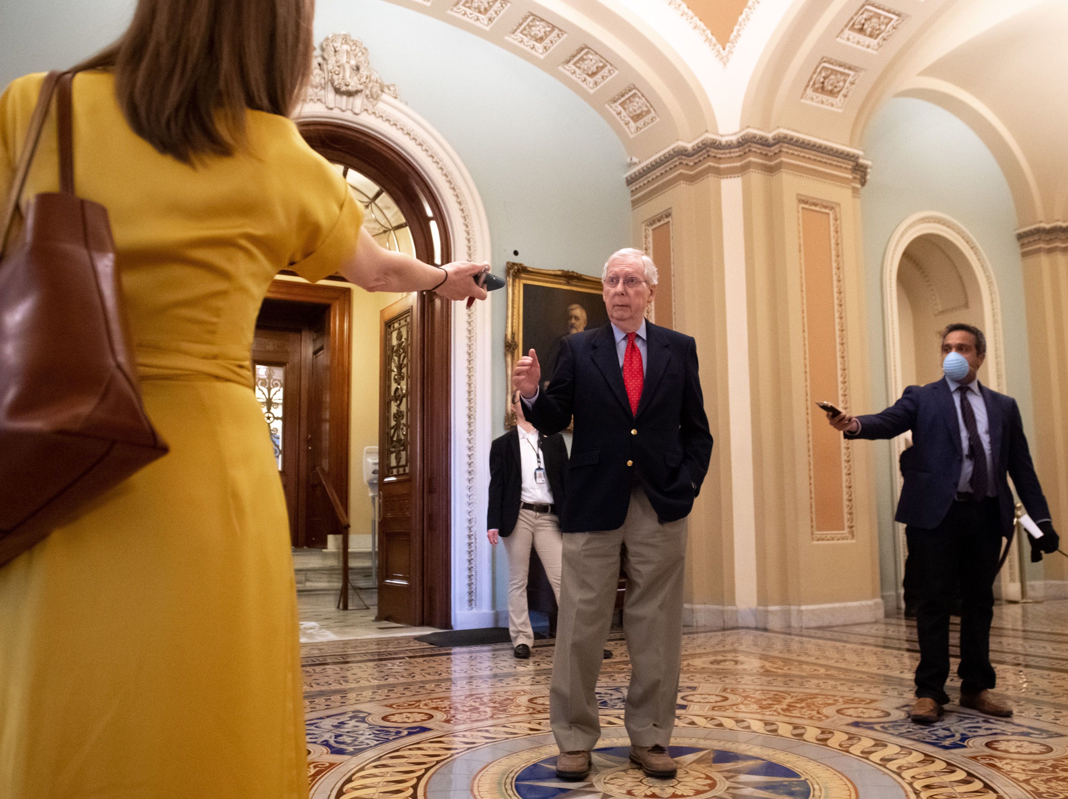 caption: Senate Majority Leader Mitch McConnell speaks to reporters after leaving the Senate floor on April 9.