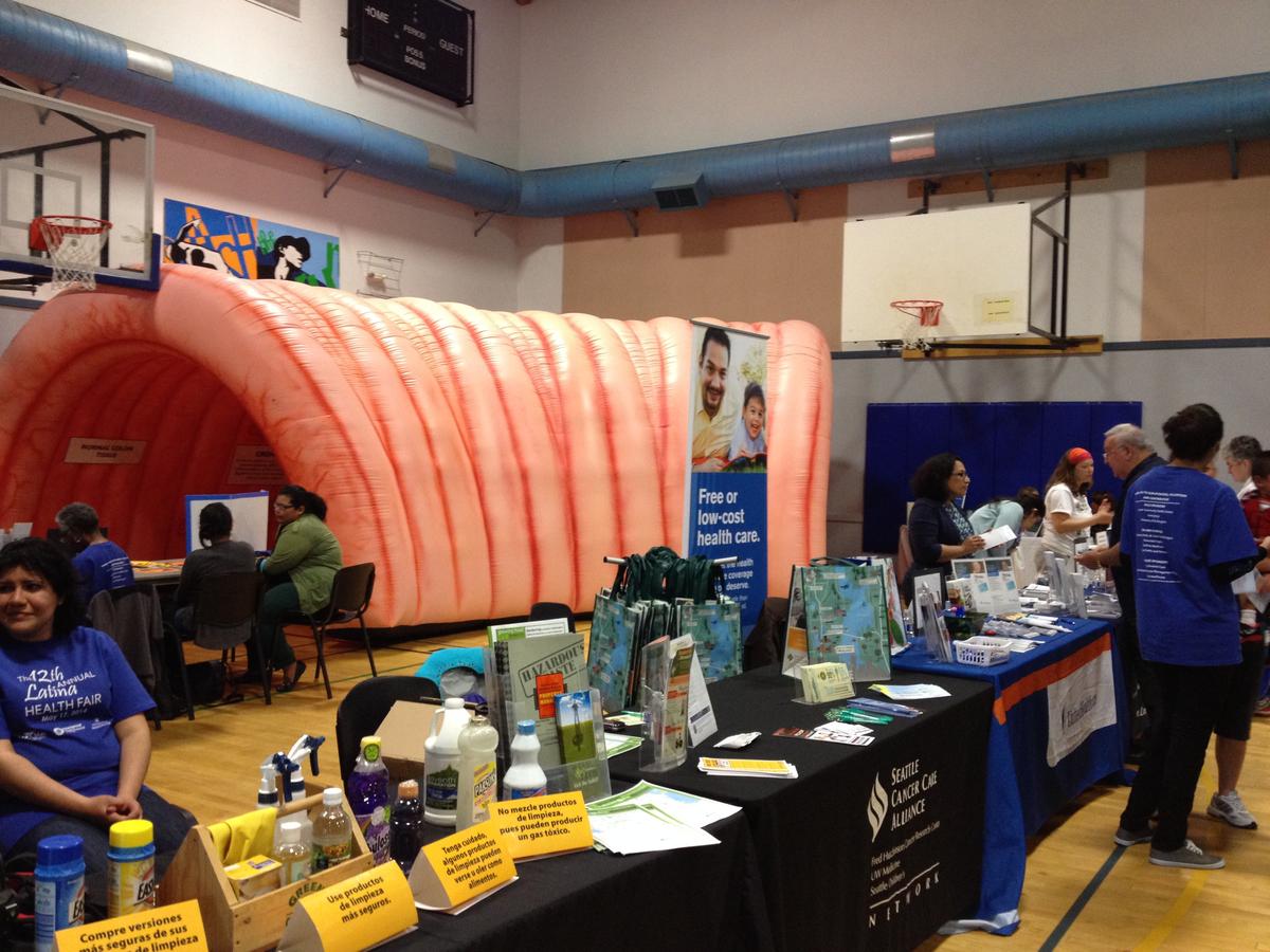 caption: "Nolan the Colon" is featured at the annual Latina Health Fair in South Park. Residents can drop in for health screenings and get health information.