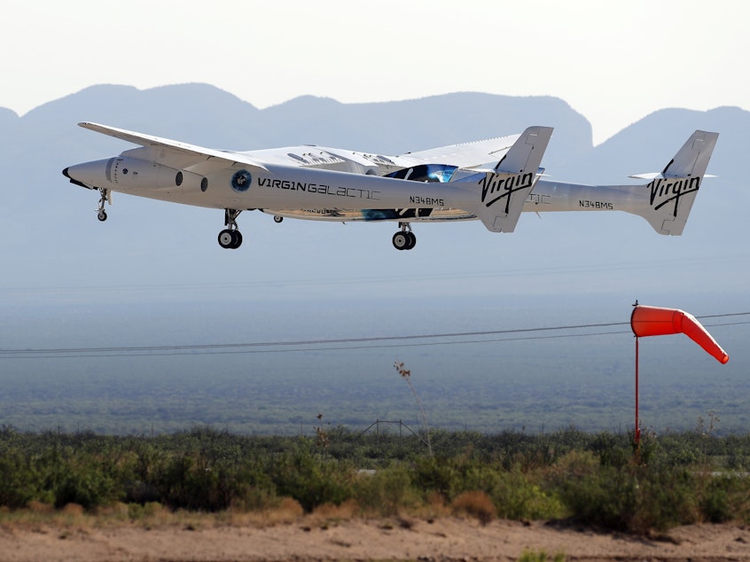 caption: The rocket plane carrying Virgin Galactic founder Richard Branson and other crew members takes off from Spaceport America near Truth or Consequences, N.M. Sunday, July 11, 2021. (AP Photo/Andres Leighton)