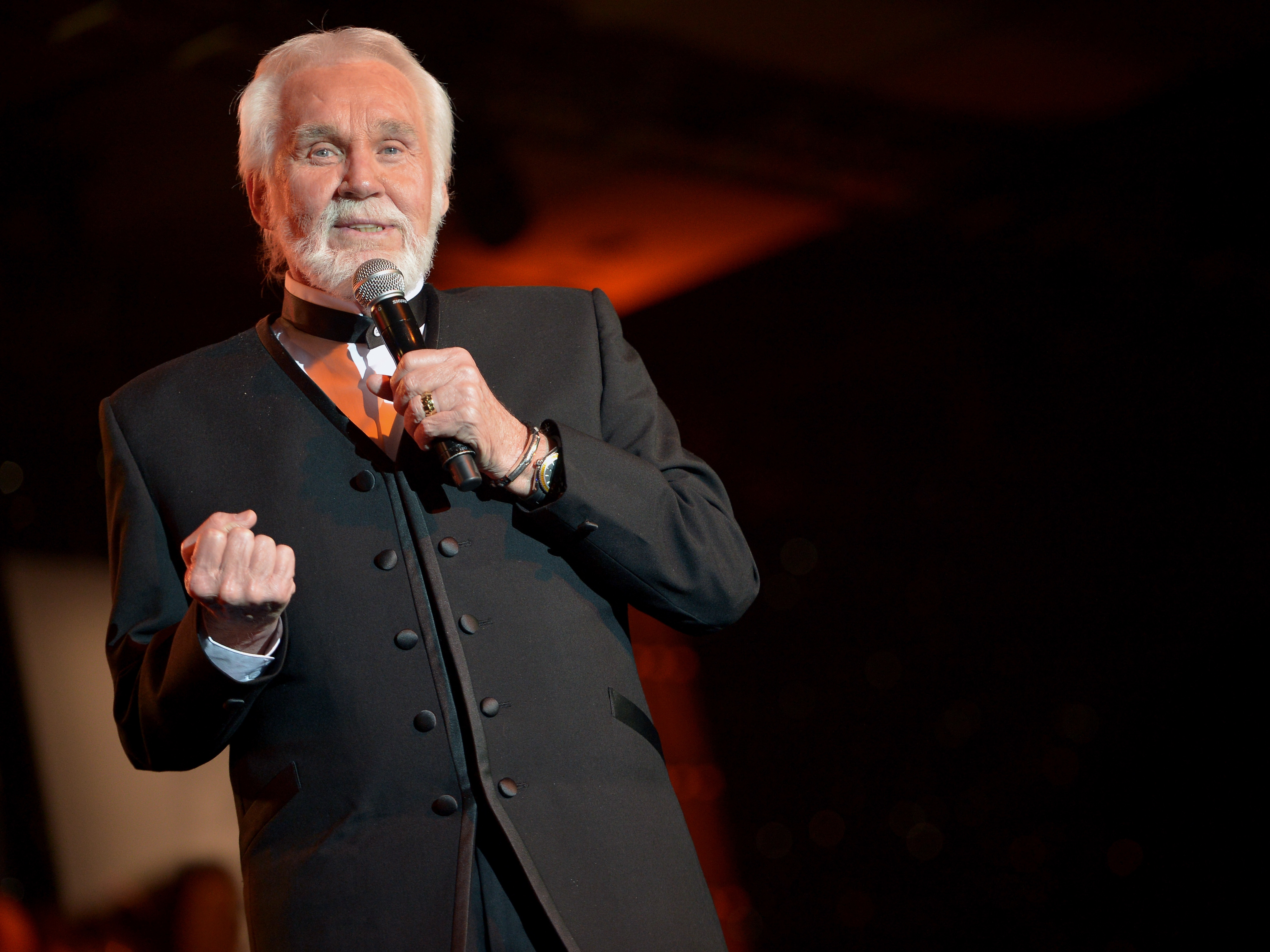 caption: Kenny Rogers performs during Muhammad Ali's Celebrity Fight Night XX in Phoenix, Ariz., in 2014.