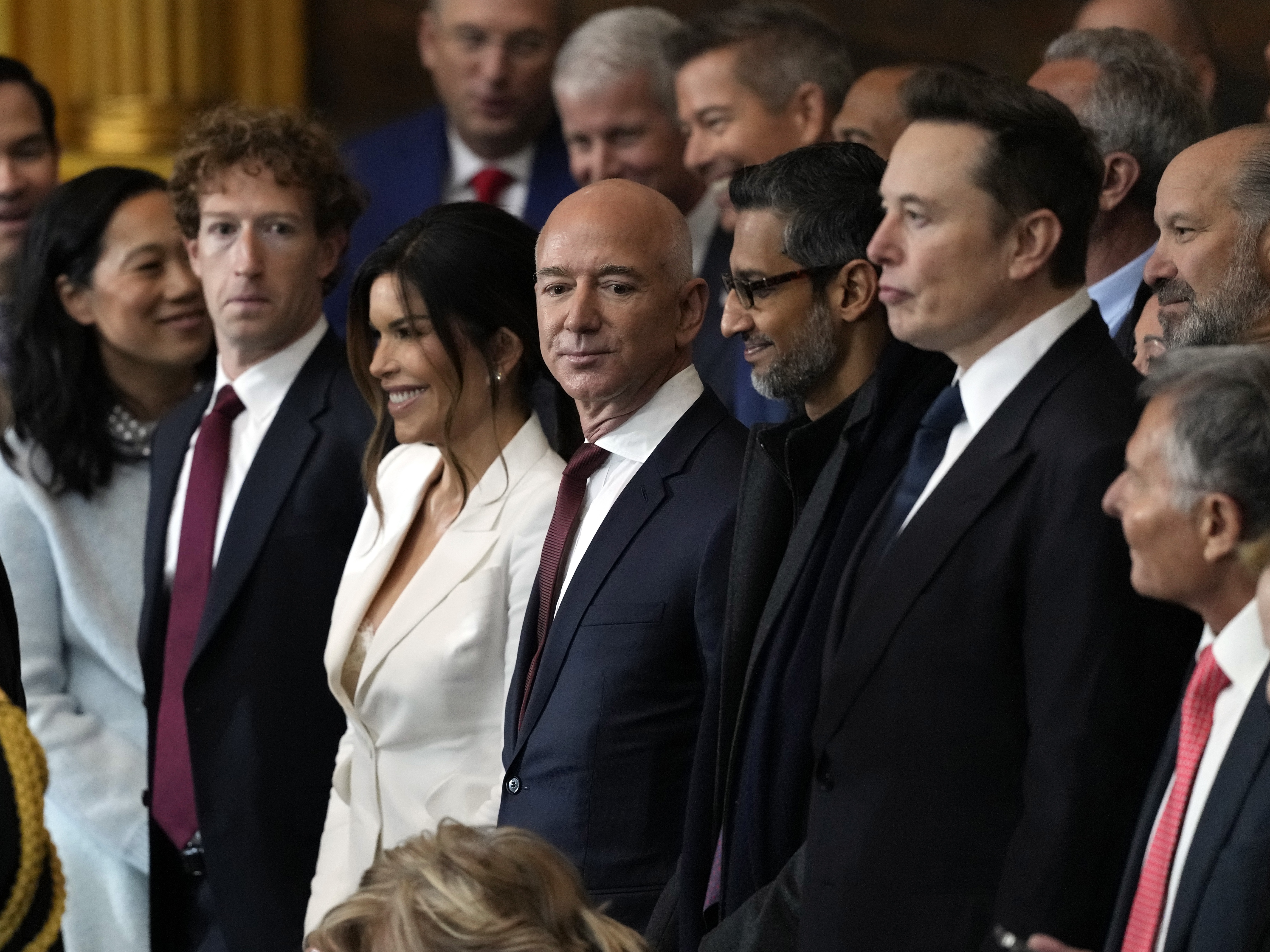 caption: Guests including Meta CEO Mark Zuckerberg, Amazon founder Jeff Bezos, Google CEO Sundar Pichai and Tesla CEO Elon Musk arrive before Donald Trump's second-term presidential inauguration in the rotunda of the U.S. Capitol on Jan. 20.