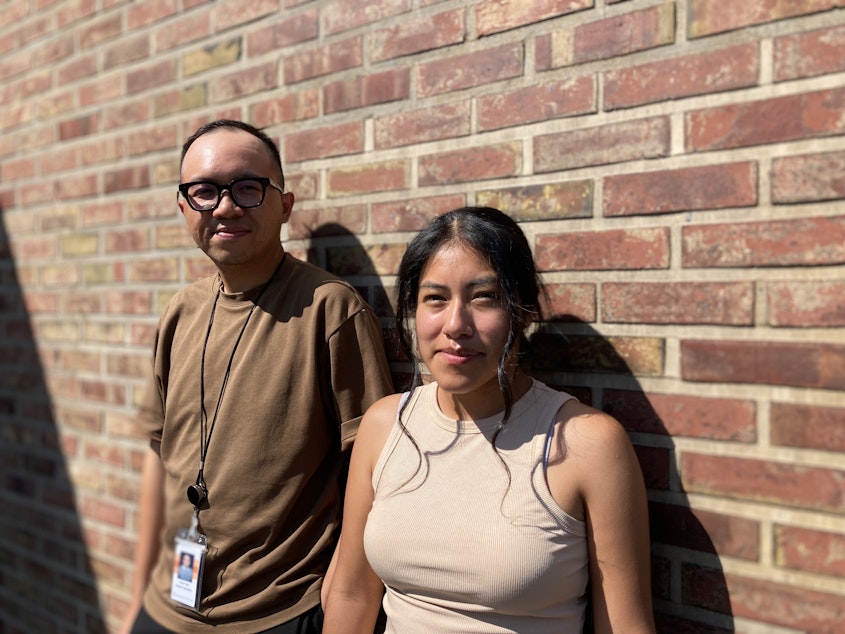 caption: Seattle World School health clinic patient navigators Justin Van and Yenifher Mendoza help students and their families access medical care.